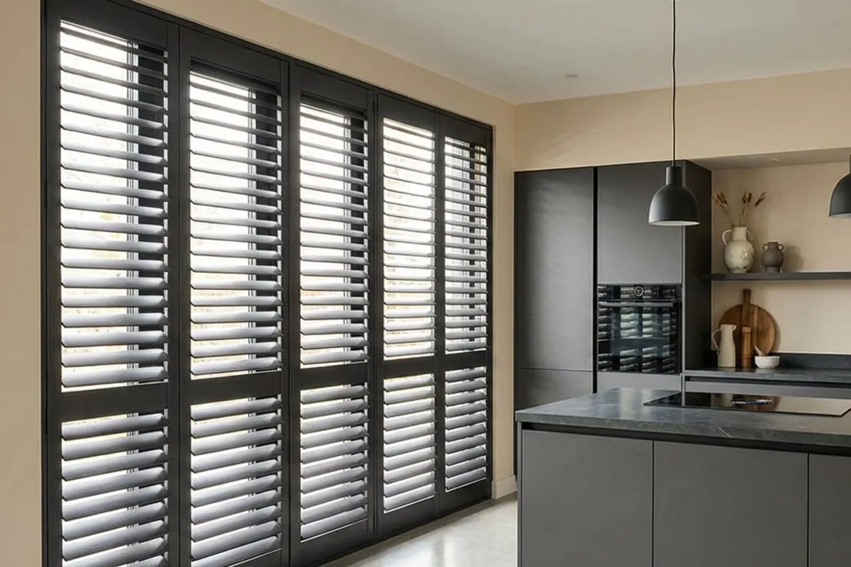Those kitchen patio doors with dark grey shutters across them (AI preview)
