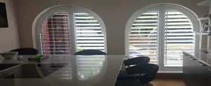 Shutters pictured in the article Arched Window Shutters vs. Curtains: Which is the Right Choice for Your Home?