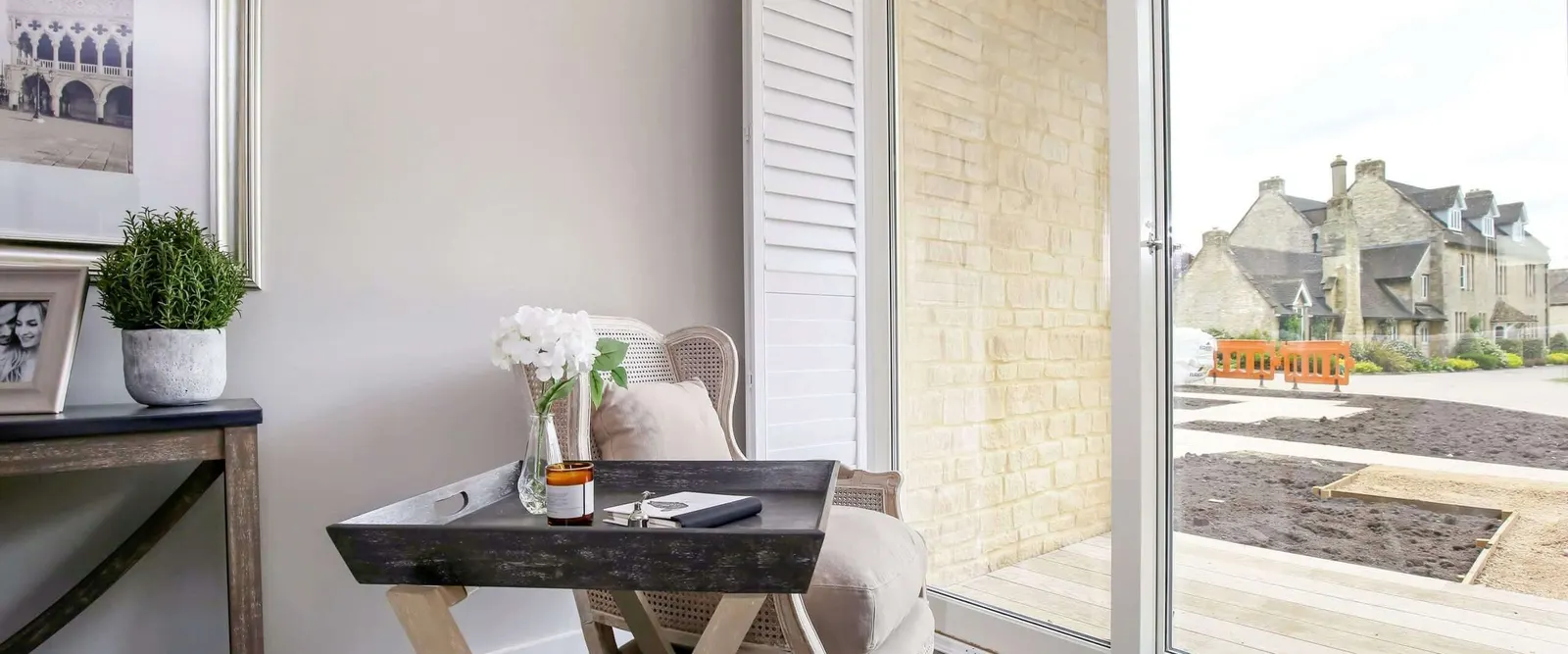 Reception room garden doors with bi-fold shutter panels