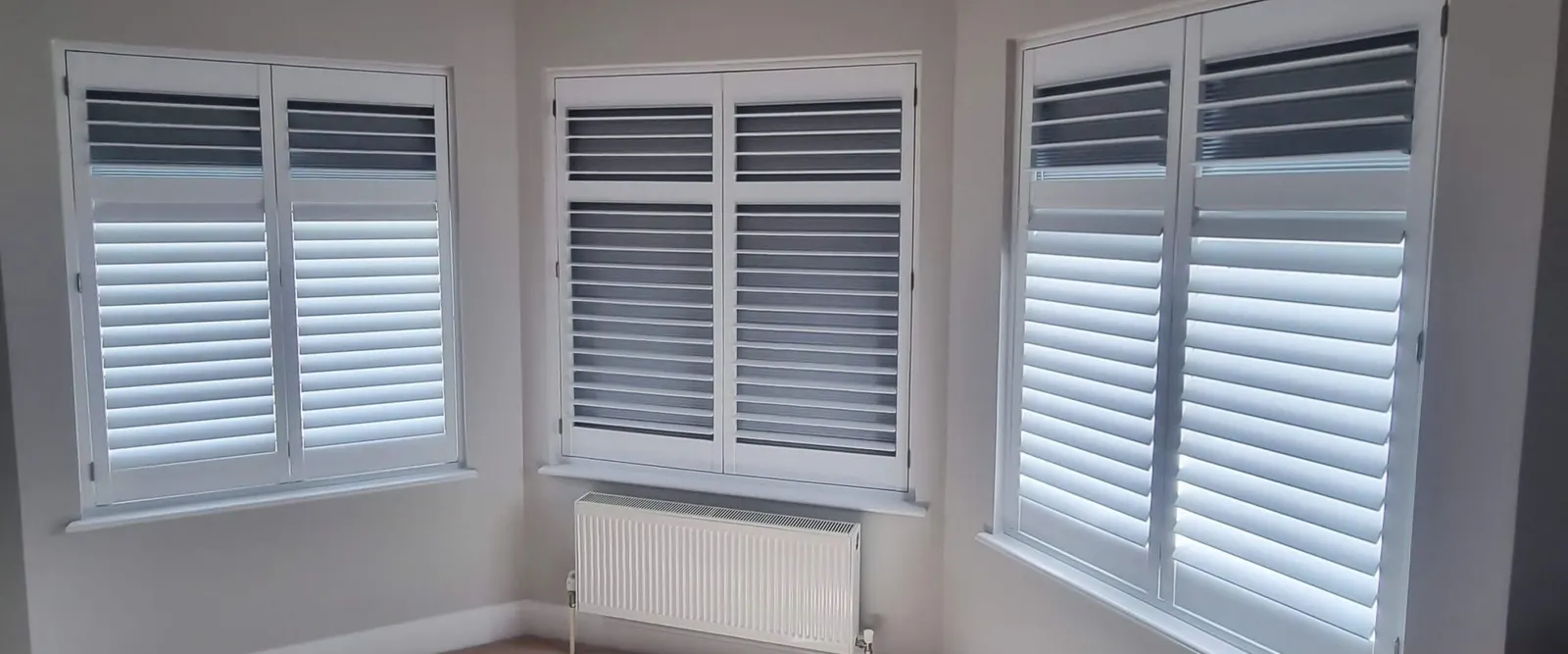 Bedroom bay window fitted with blackout shutters