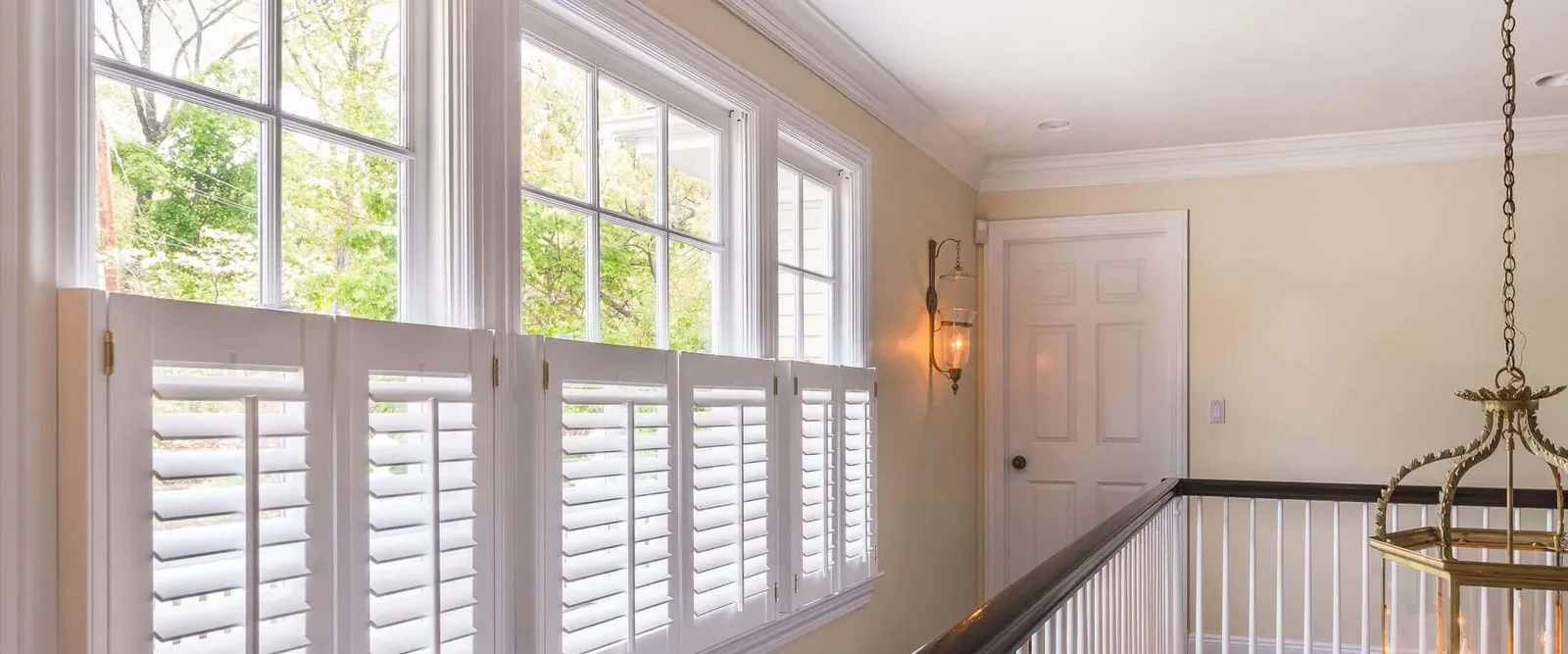 Landing window with café style shutters