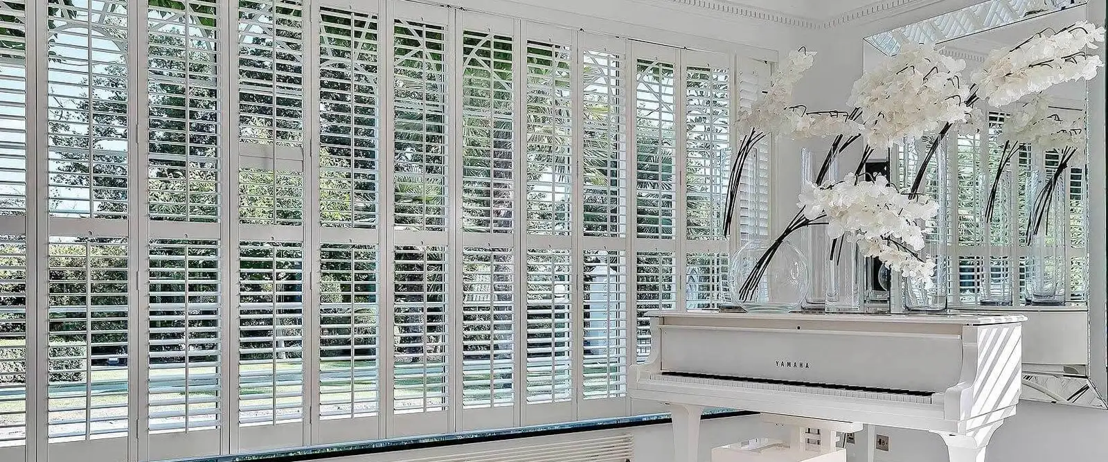 Bright conservatory with Seattle shutters fitted to each window