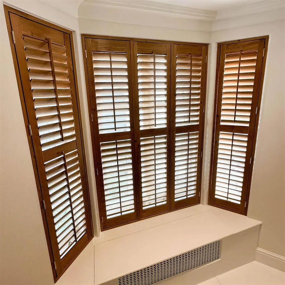 Bay window seat framed by stained Montana hardwood shutters