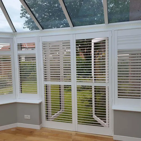 Door panels of conservatory shutters folded open