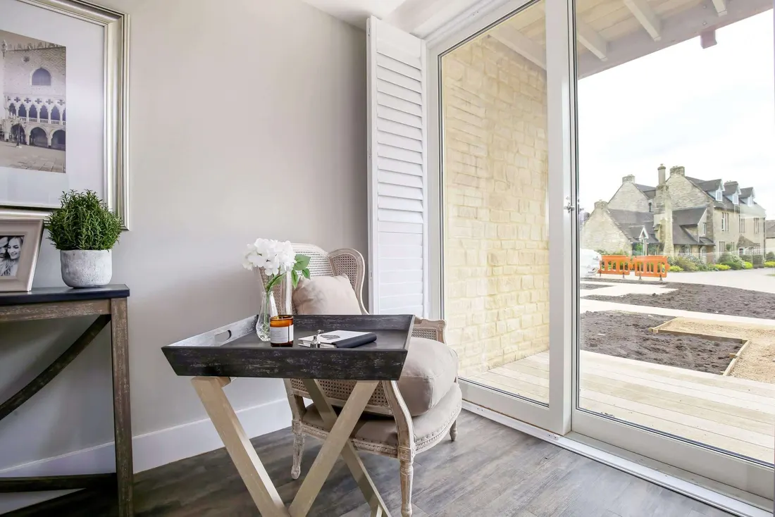 Patio doors open to the patio with their shutters folded back