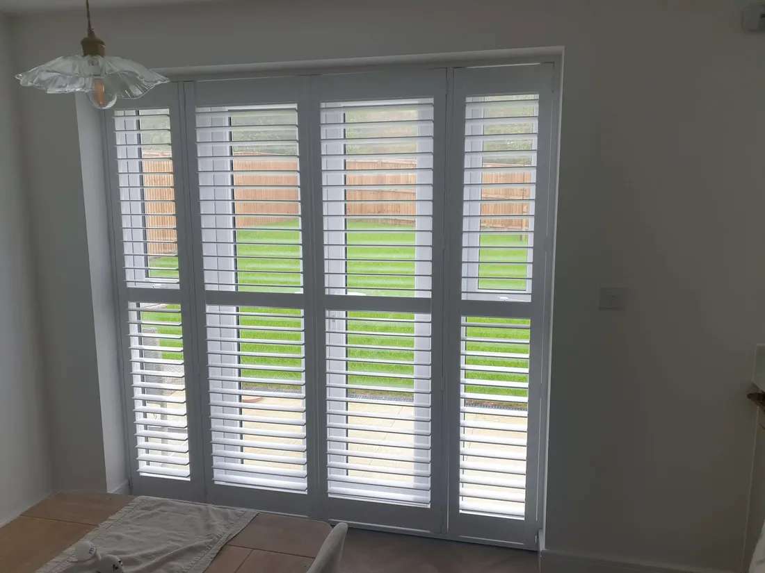 Garden doors with white shutters and a mid rail